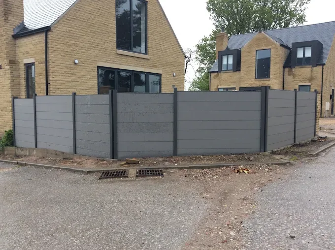 Modern grey composite fencing panels with steel posts